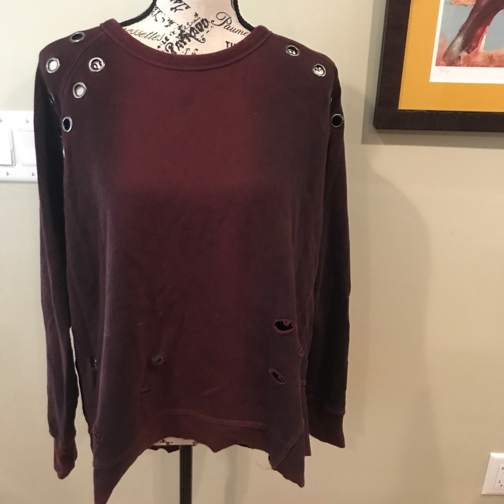 High low maroon sweater with metal hole designs